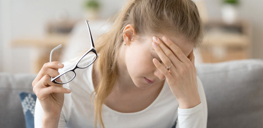 Woman suffering migraine