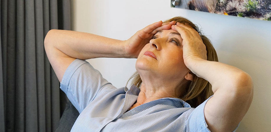 Woman suffering from headaches